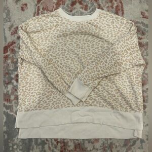 cream and white cheetah pattern crew neck
